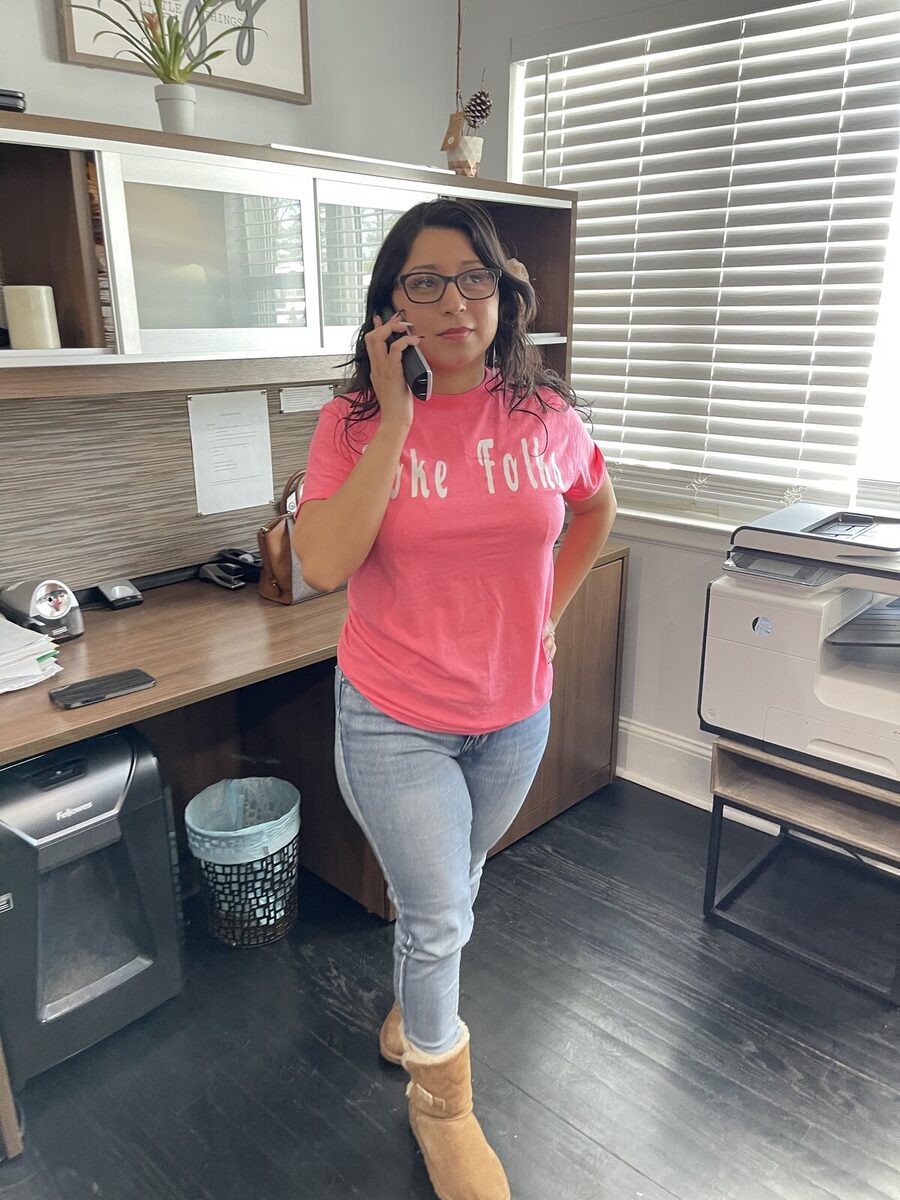 Wearing a pink Toke Folks tee at the office